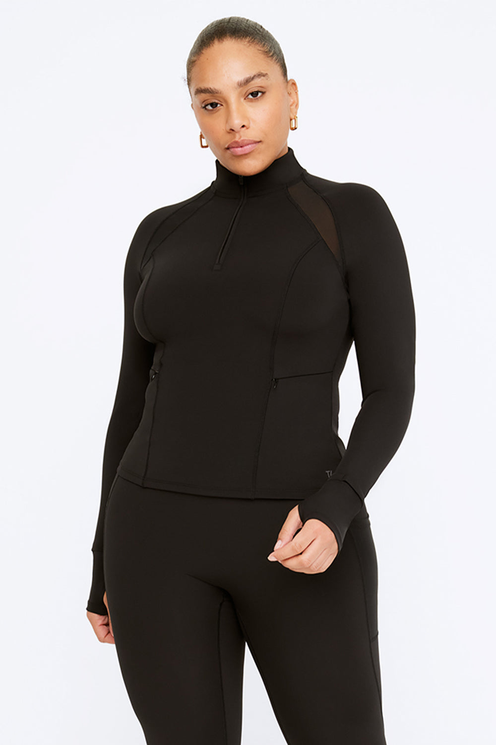 https://www.wearetala.com/cdn/shop/files/BLACK_QUARTER_ZIP_JACKET.jpg?v=1704359084