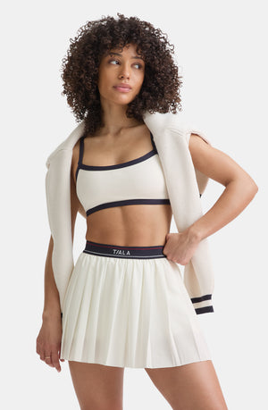 DAYFLEX LOGO PLEATED SKORT - IVORY